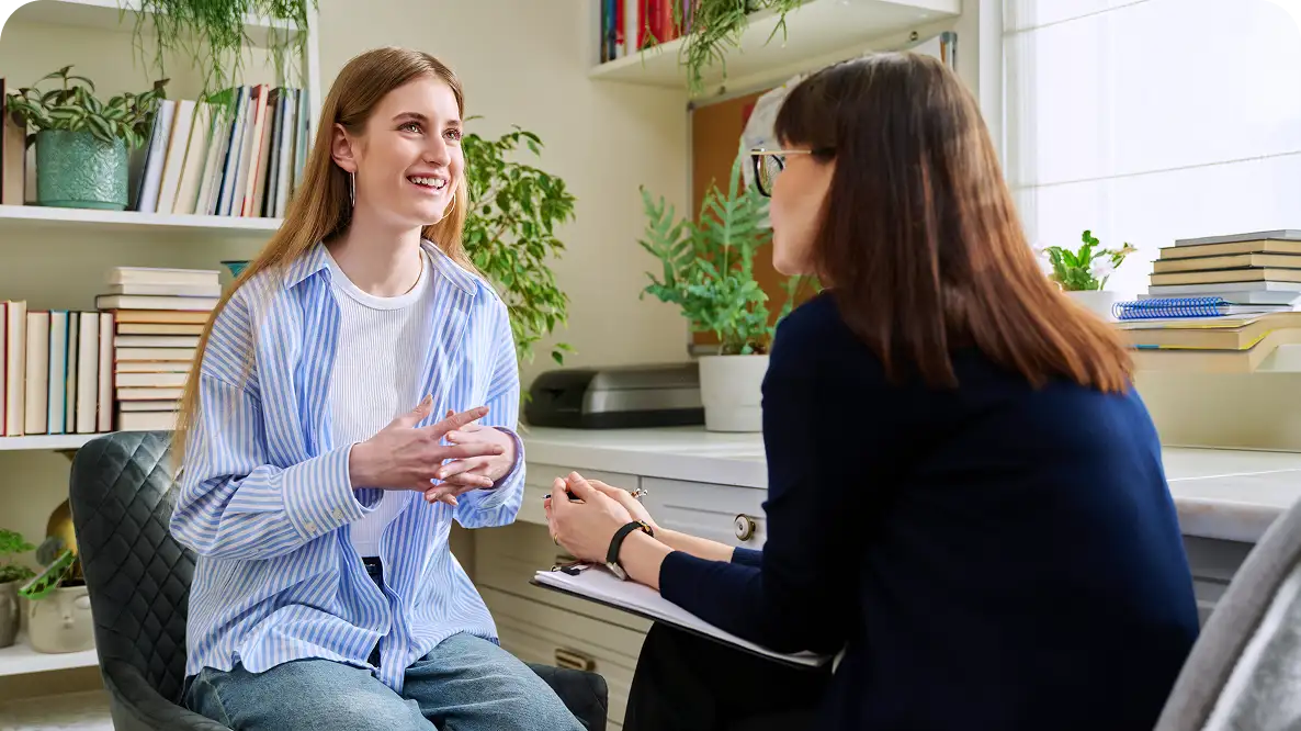 Mood Stabilizers Two women having a conversation in office.